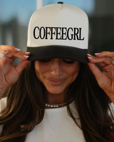 Person wearing a cap with 'COFFEEGRL' text, blurred background