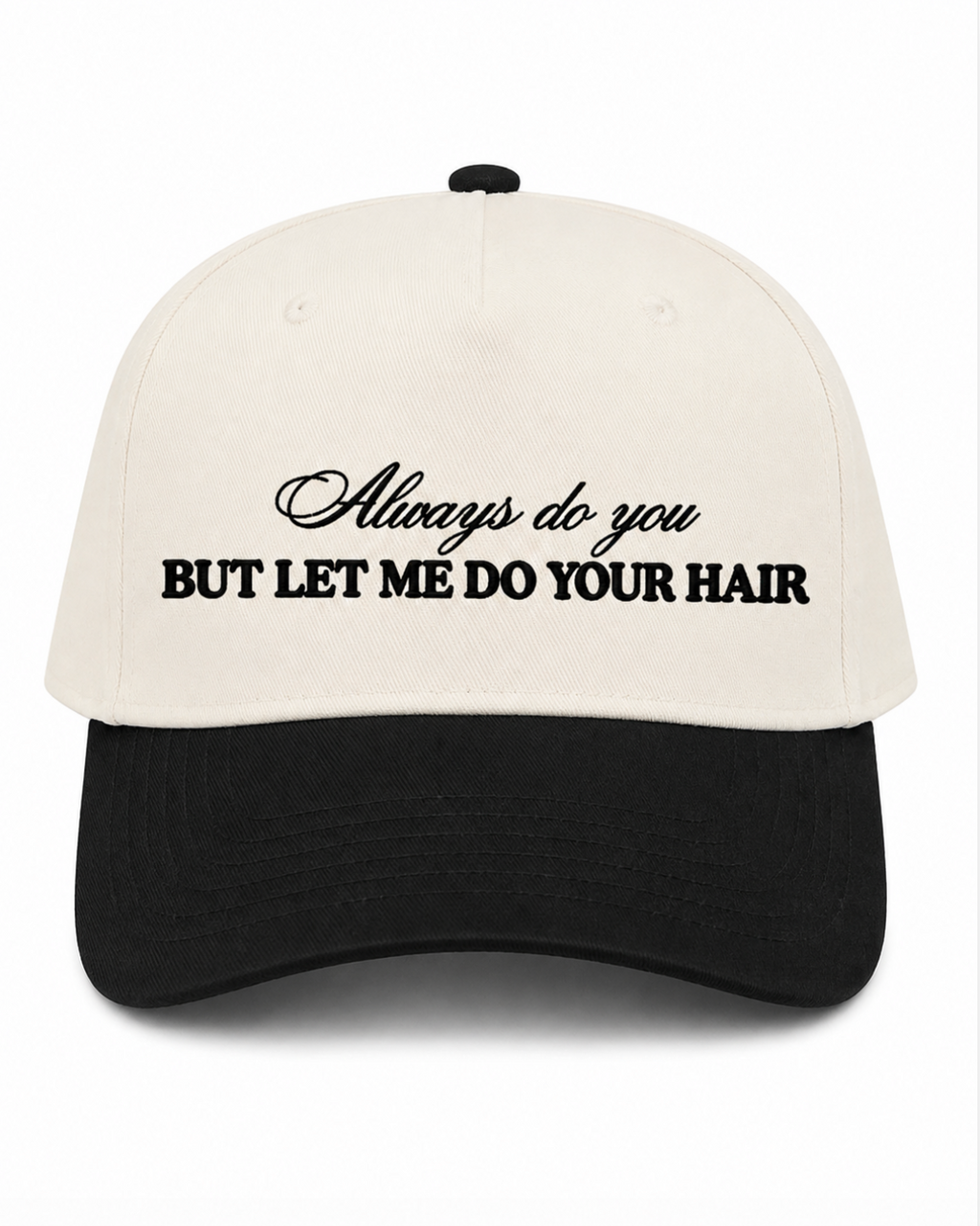 A baseball cap with an off-white crown and a black curved brim, featuring the embroidered text 'Always do you BUT LET ME DO YOUR HAIR' in black on the front.