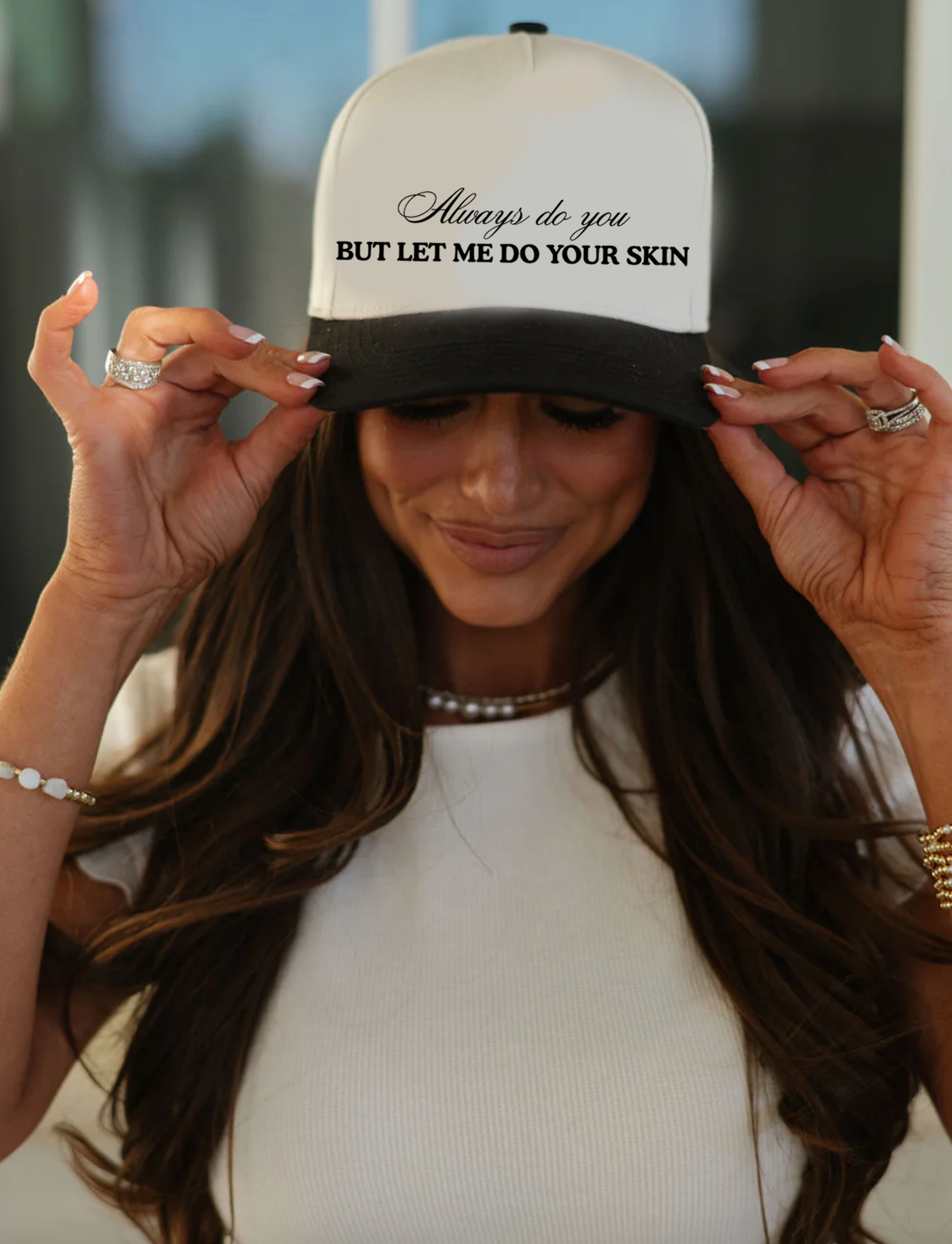 Person wearing a cap with text and a blurred background