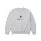 A light heather gray crewneck sweatshirt featuring a small embroidered Philadelphia goose graphic and the text 'philly goose' in green script on the chest, displayed against a solid white background.