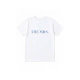 A white short-sleeve crewneck t-shirt with the text 'THE MRS.' printed in light blue across the chest, displayed flat against a solid white background.